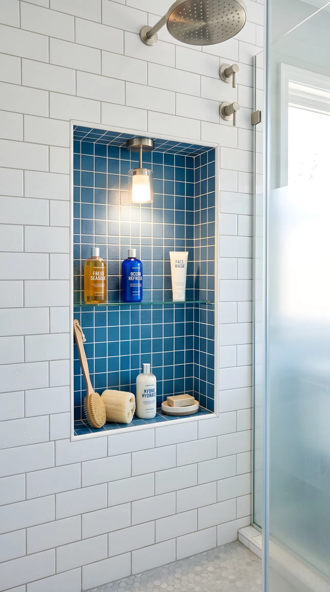 A real-life shower photo with a blue tiled niche (RGB 50,100,140) lit from above by a small waterproof pendant light positioned slightly off-center, light spreading evenly across the textured tile, neatly arranged shower items inside the niche, organized, clean, bright natural light blending with the pendant glow, vibrant color, photographic stock-photo style.
